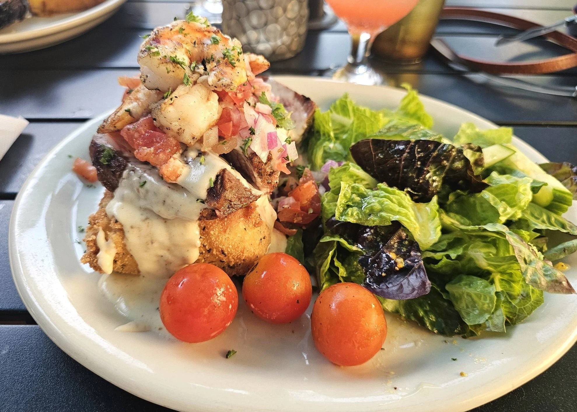 Shrimp on steak over fried grits with a creole sauce, a special featured at the Tamarind.