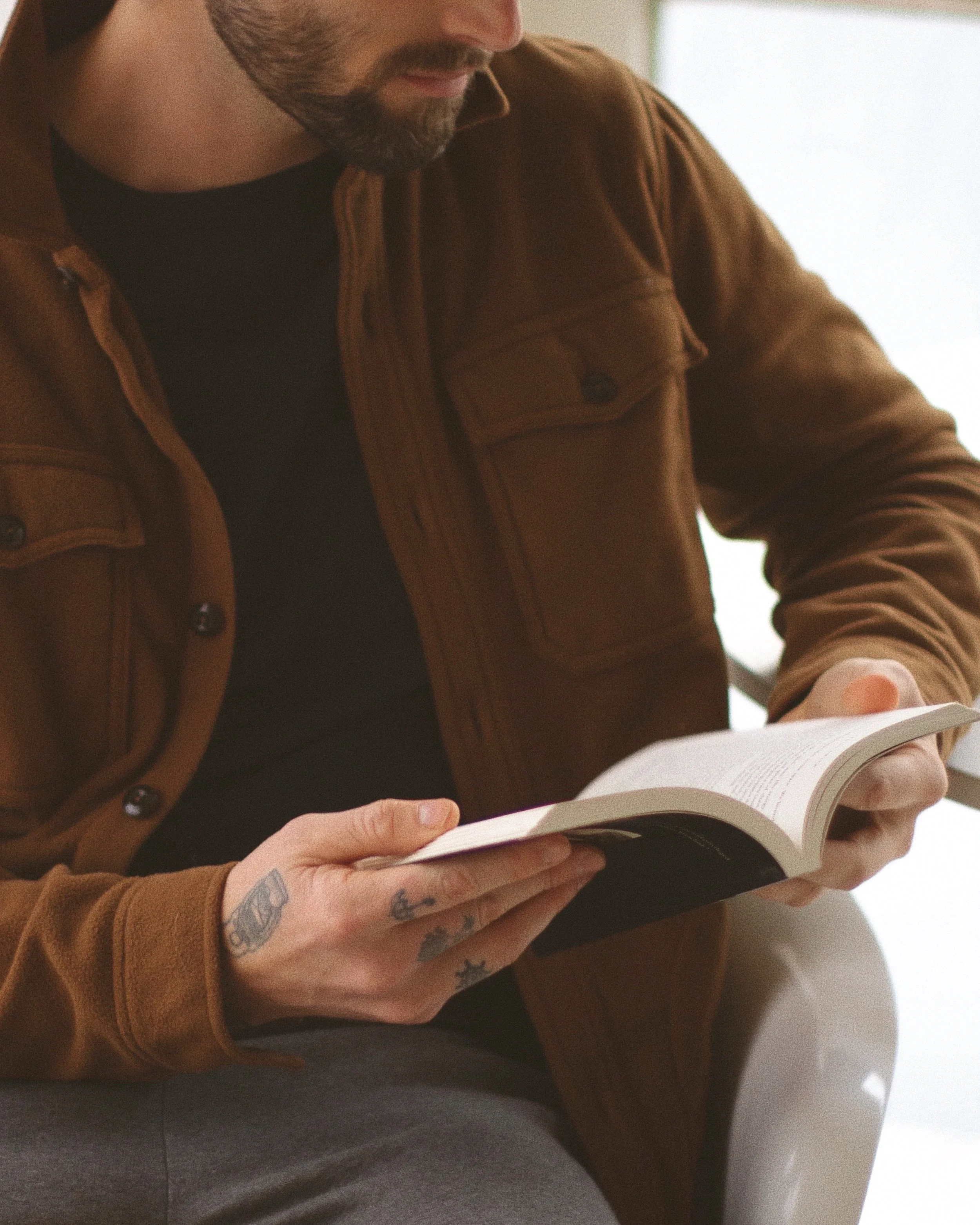 man reading a book during christian anxiety counseling