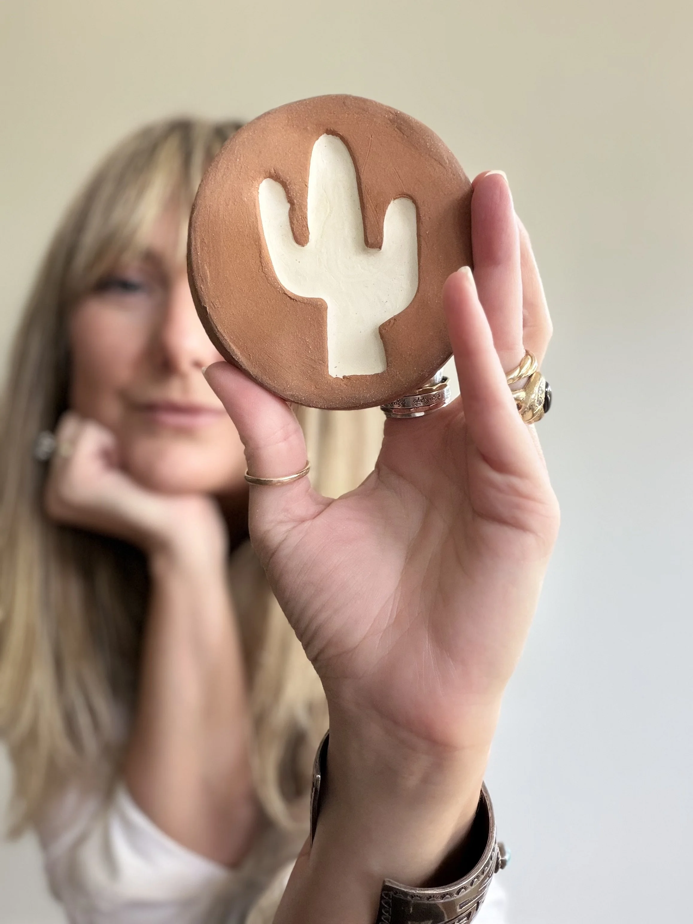 Meagan with a hand-built coaster