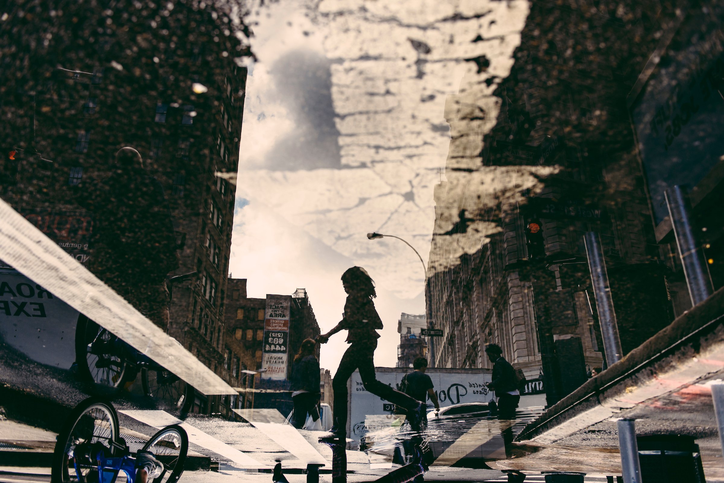 woman-street-puddle-reflection.jpg