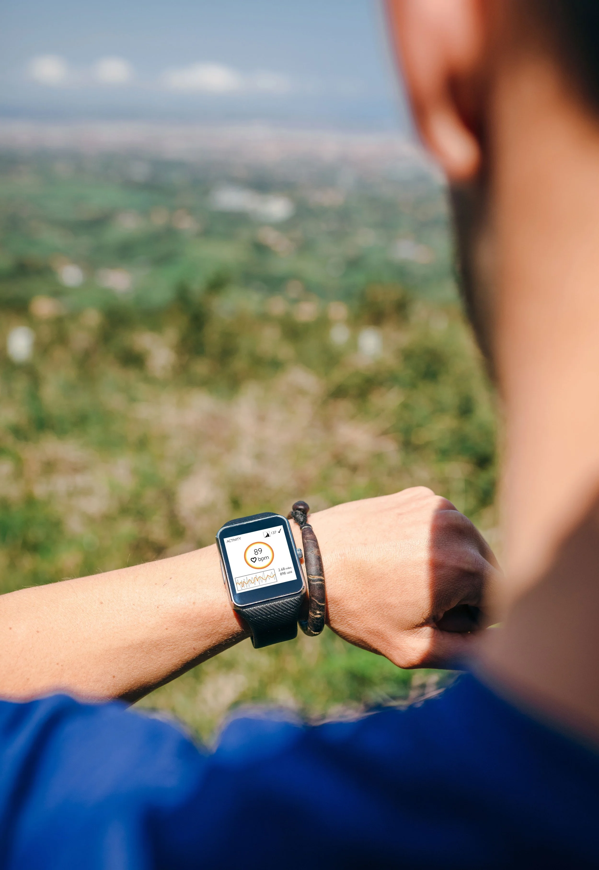arm with Apple watch showing ECG and heart rate