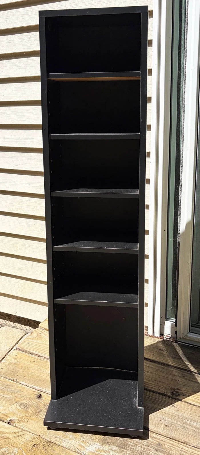small vertical black bookshelve