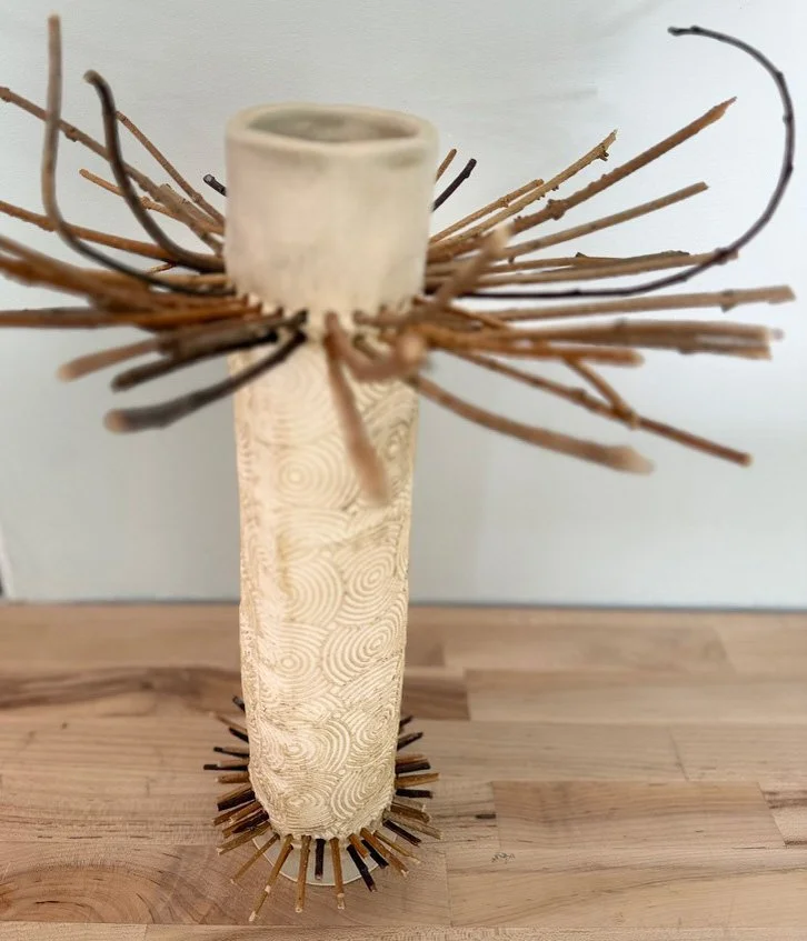 Susan Siegel, totem with pattern etched in clay and sticks.