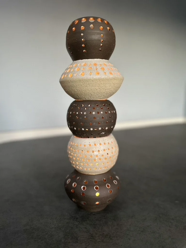 
Susan Siegel, candle totem.  Light is also a natural element filling her pots.