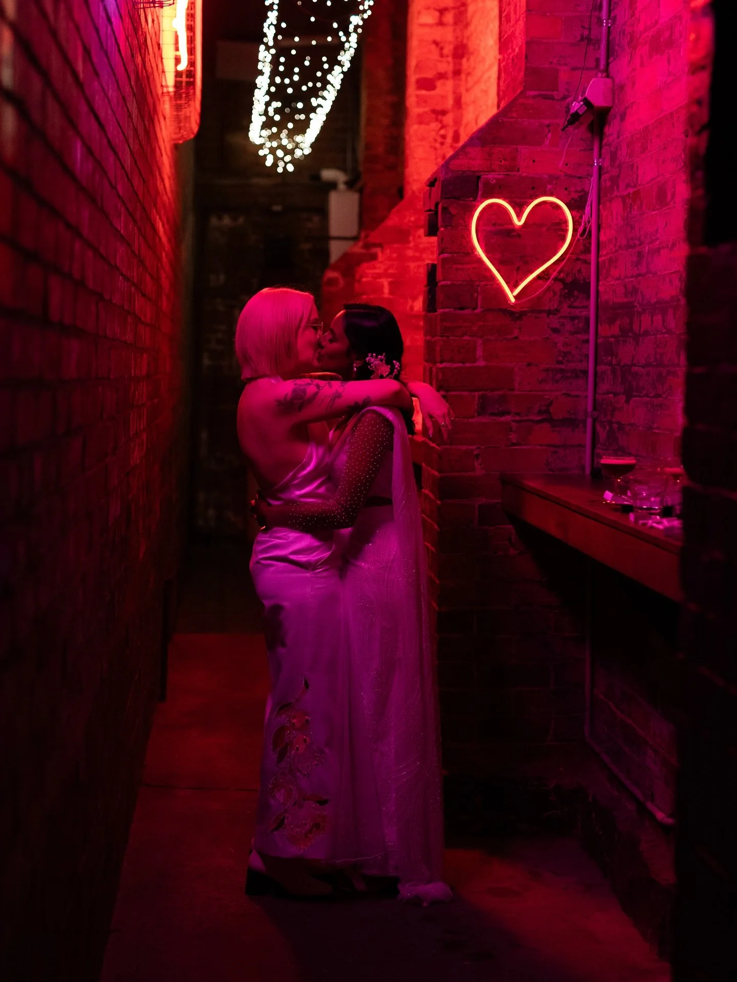 Neon hearts and loved-up babes Mardi &amp; Shali ❤️&zwj;🔥😍

Mardi&rsquo;s incredible custom suit features an &lsquo;M&rsquo; and &lsquo;S&rsquo; on the lapel, and I&rsquo;m obsessed with Shali&rsquo;s pearl and sequin adorned sari! 🤍

M&amp;S tied