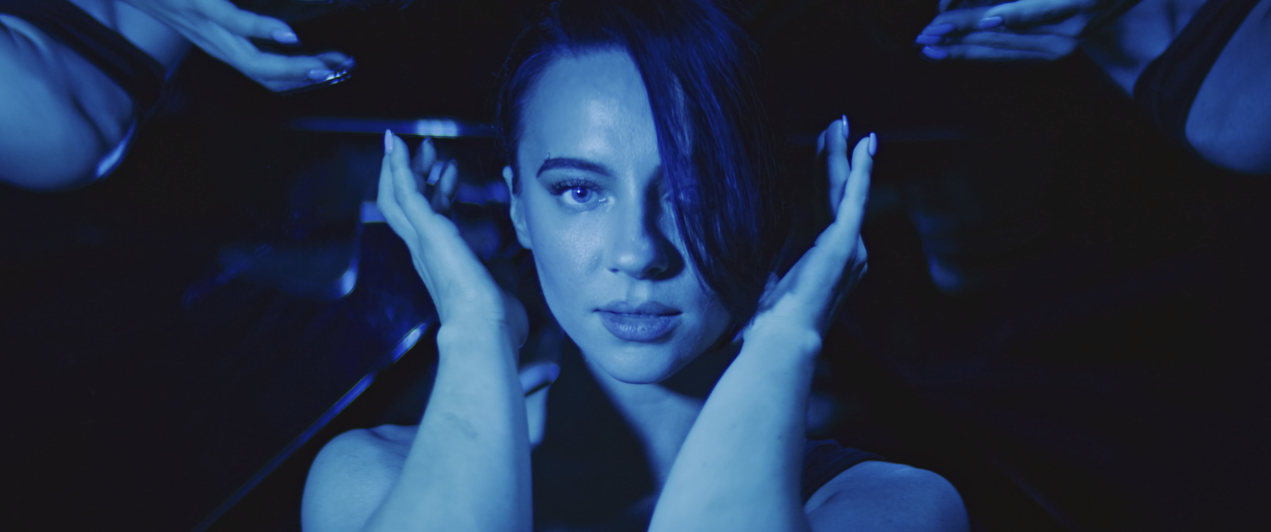 Kyndle Wylde in a blue mirror room