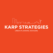 KARP Strategies logo with city skyline and wind turbine on an orange background
