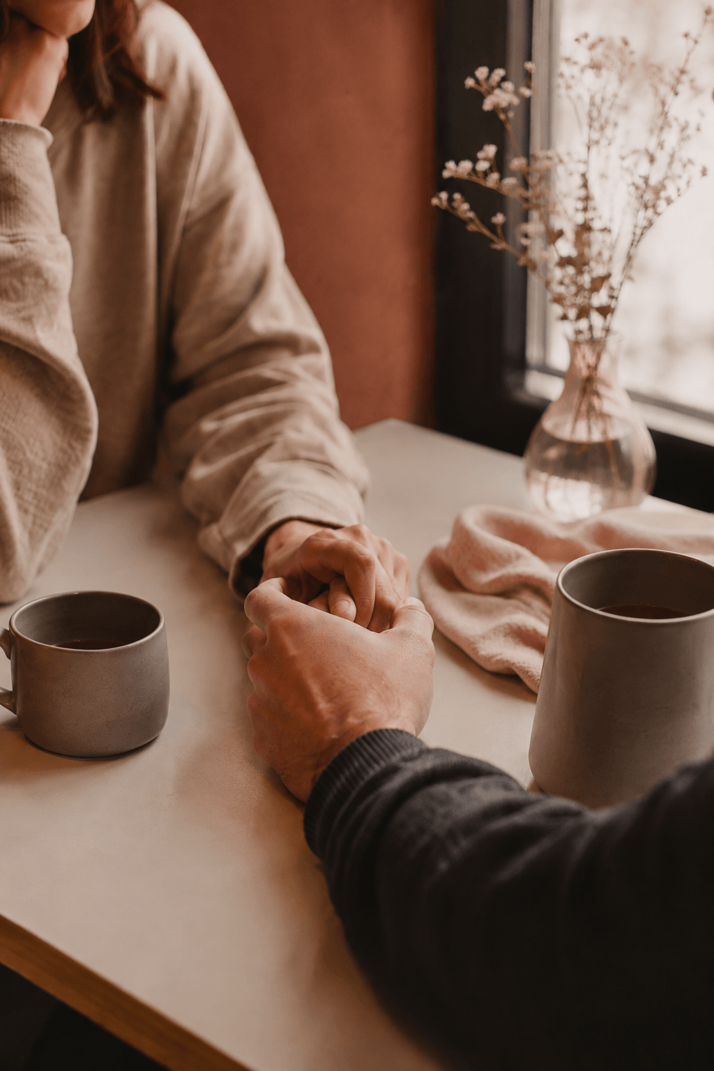 couple holding hands representing their readiness for couples therapy with Natalie Gaida
