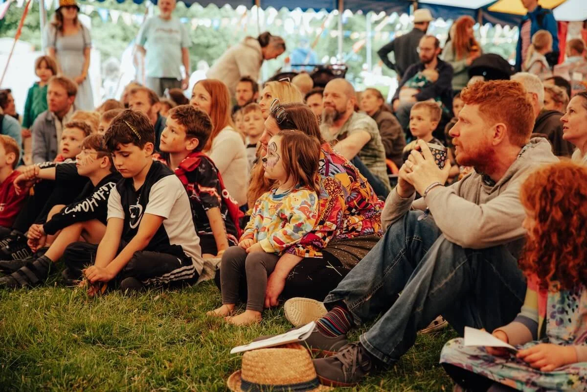 Families enjoying free entertainment at Devauden Festival