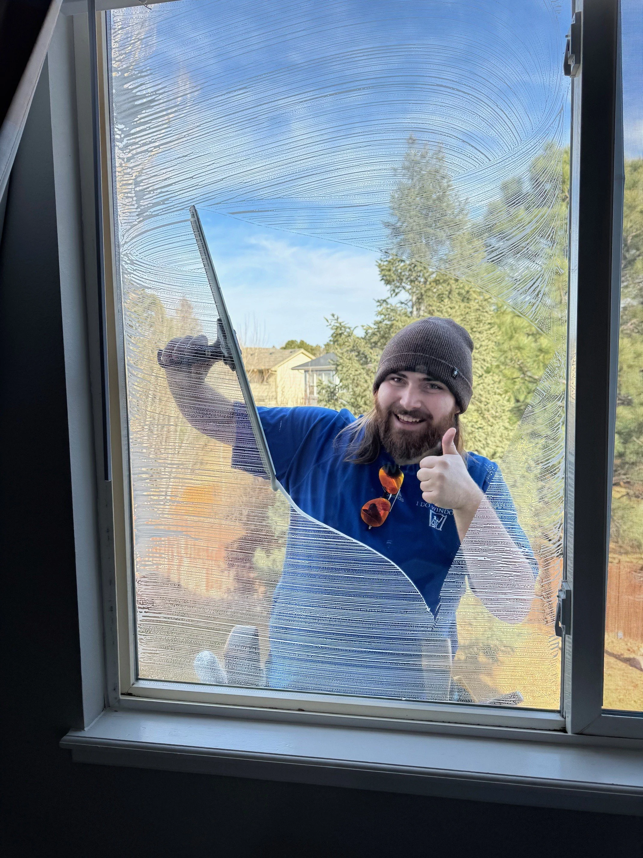 Jaxon cleaning a window