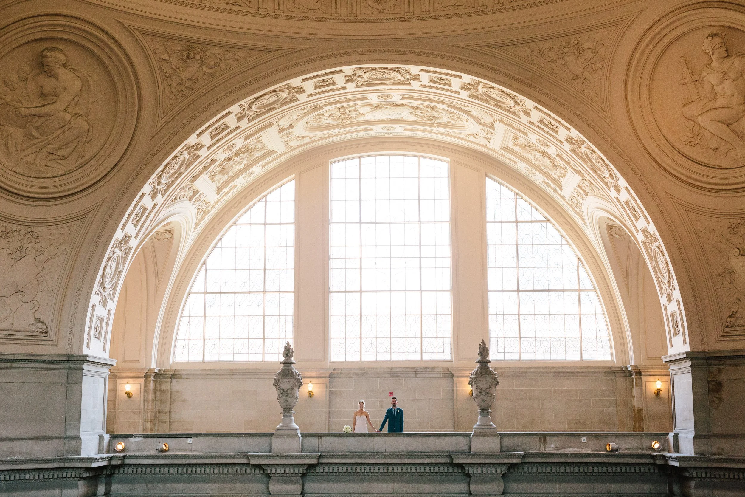 Laurie’s customers, Evan and Kade, running down a mountain after getting married. 