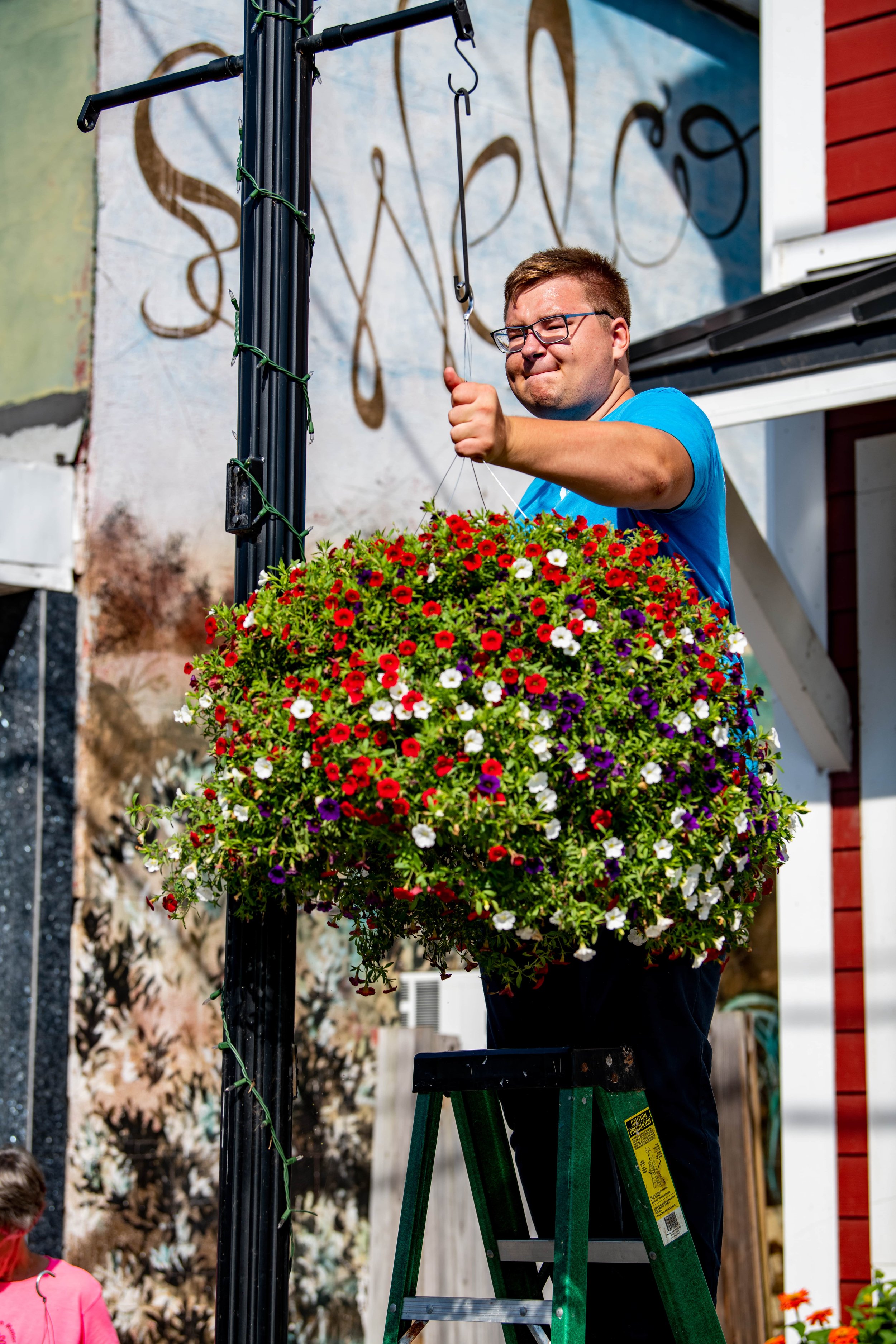 Sullivan 180 Intern with Hanging Flower Basket.jpg