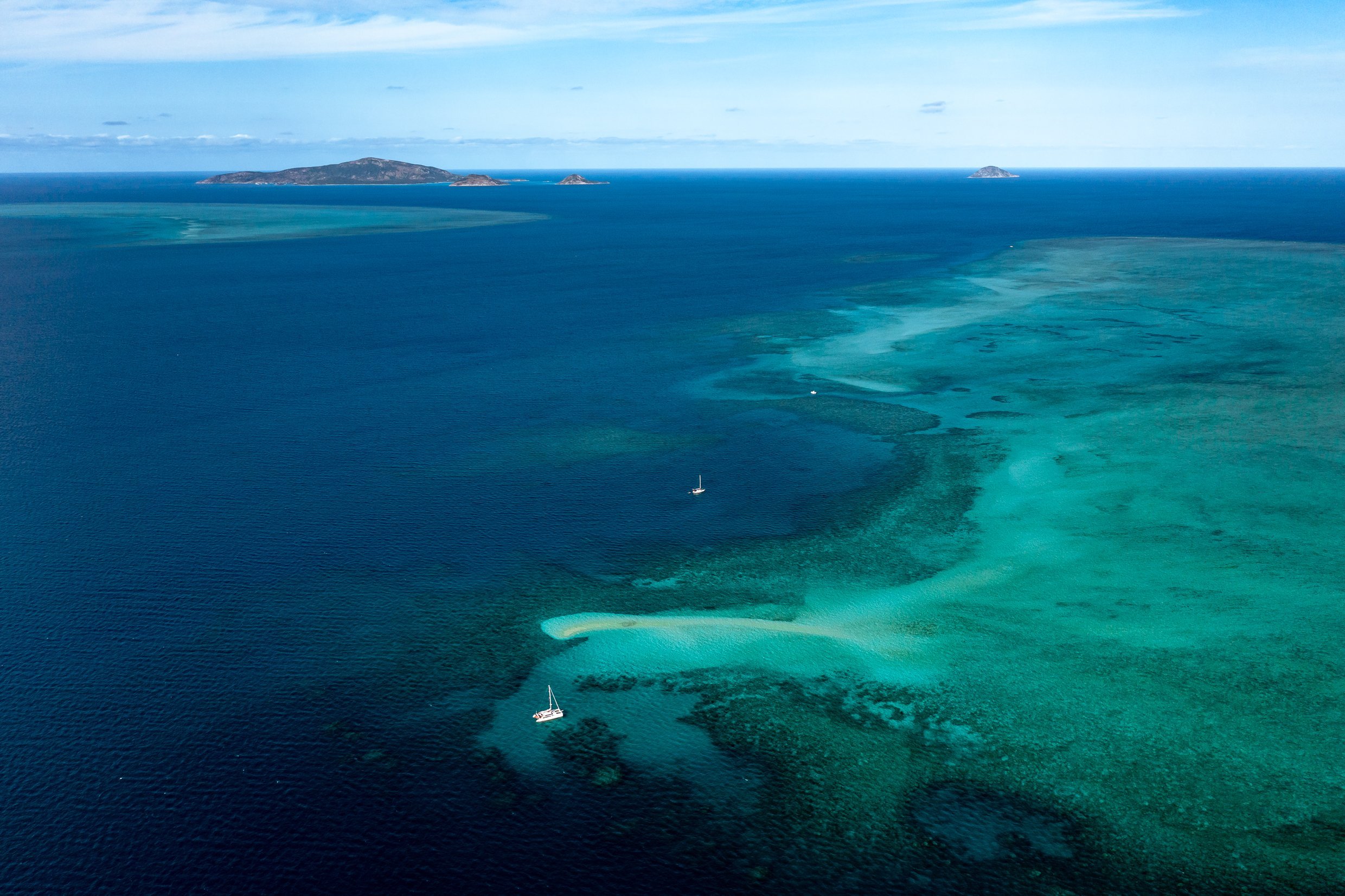 Just southwest of Lizard Island is a beautiful sand cay called Martin Reef with two sailing boats anchored.