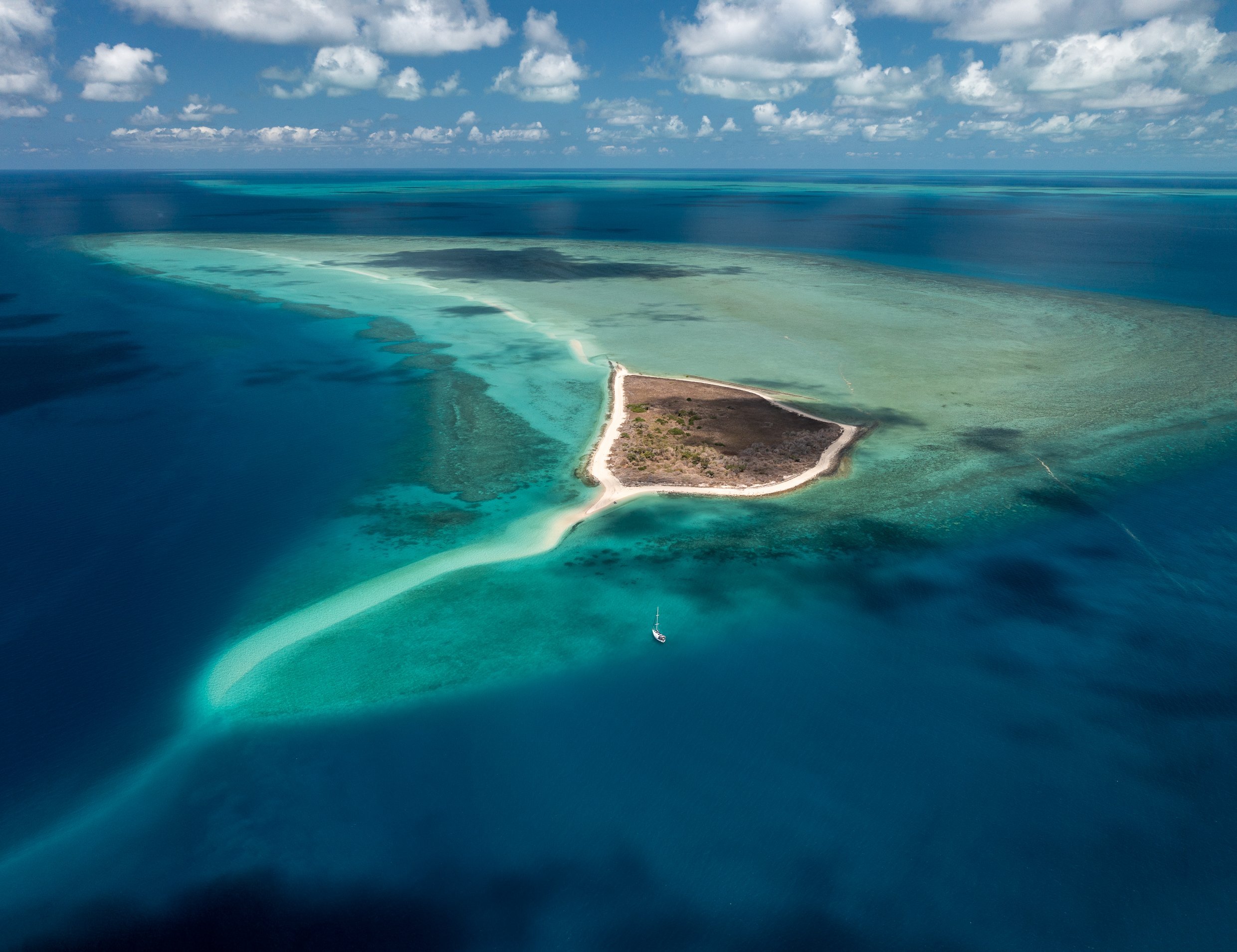 Fife Island, Great Barrier Reef.
Beautiful drone shot of Fife Island and our sailing boat, Haven. A crocodile was spotted sunning itself on the sand spit here.