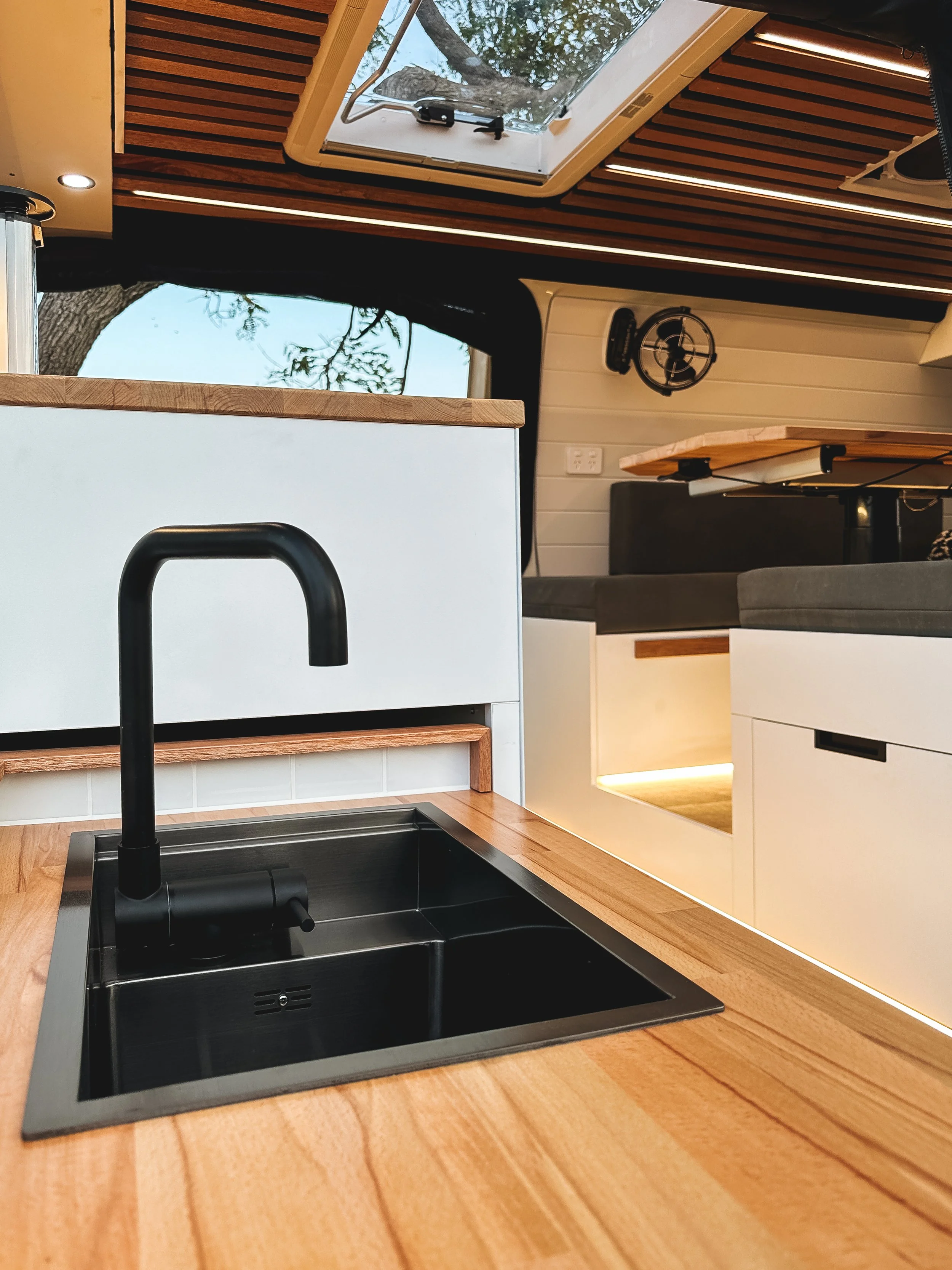 BRAND NEW Toyota HiAce Campervan Conversion with Pull Out outside Kitchen with black sink, Dometic Skylight, LED strip lighting, Dinette, 240 volt power point, Sirocco Marine 12 volt fan