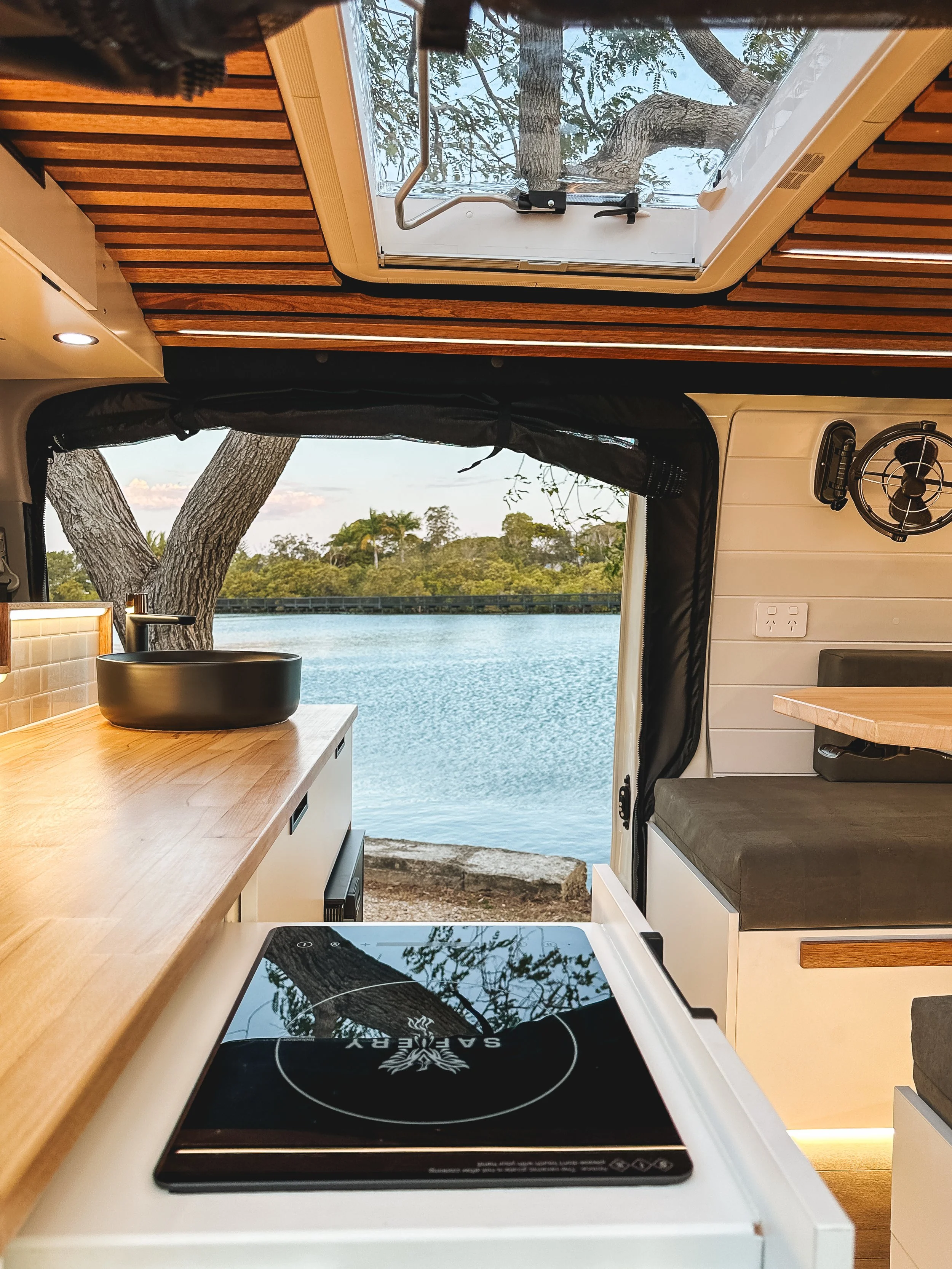 BRAND NEW Toyota HiAce Campervan Inside Kitchen with Induction Hob and Dometic Skylight/ Roof Hatch, Darkening Screen, Insect Screen, 240 volt Power Points, Sirocco Marine 12 Volt Fan, Powder Coated Aluminium Frame