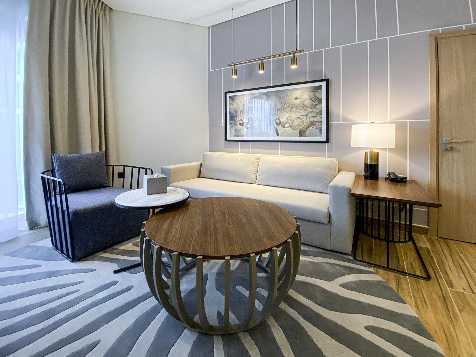 hotel room sofa armchair and coffee table