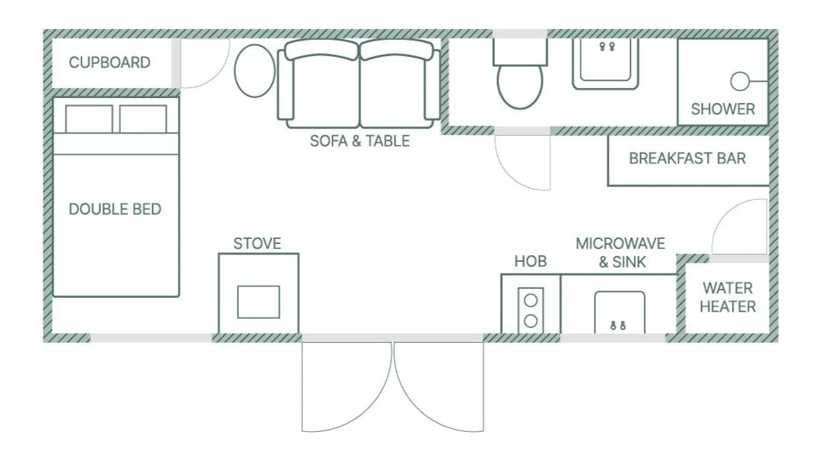 Floor plan of a small living space, featuring a double bed, cupboard, sofa and table, stove, microwave and sink, hob, water heater, breakfast bar, shower, and toilet.