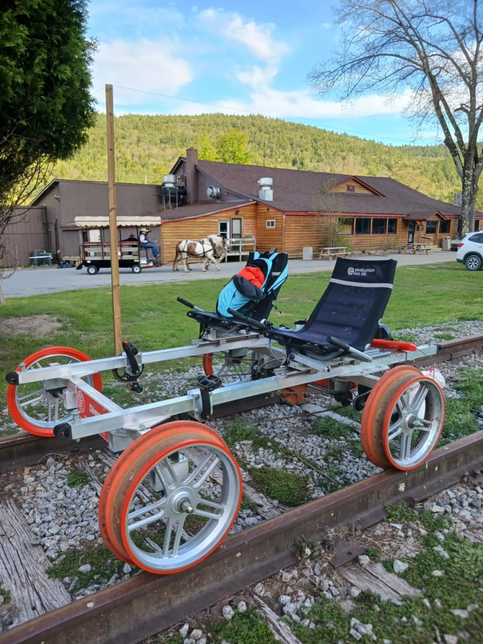 rail bike in front of Thurman Station with a backpack on the seat