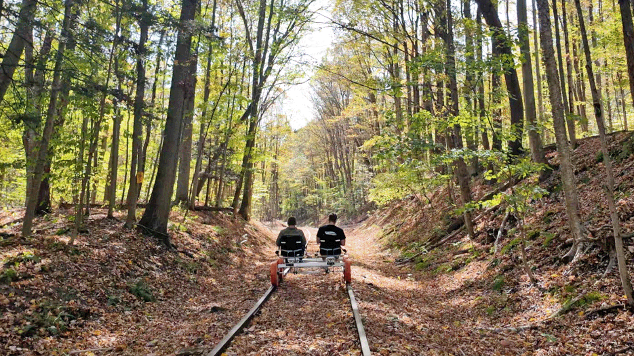 two people rail biking in western New York