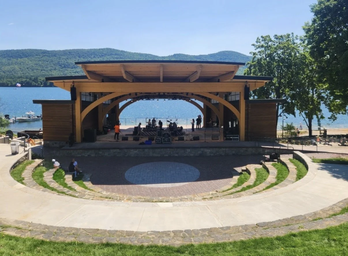 Band setting up on amphitheater by the lake