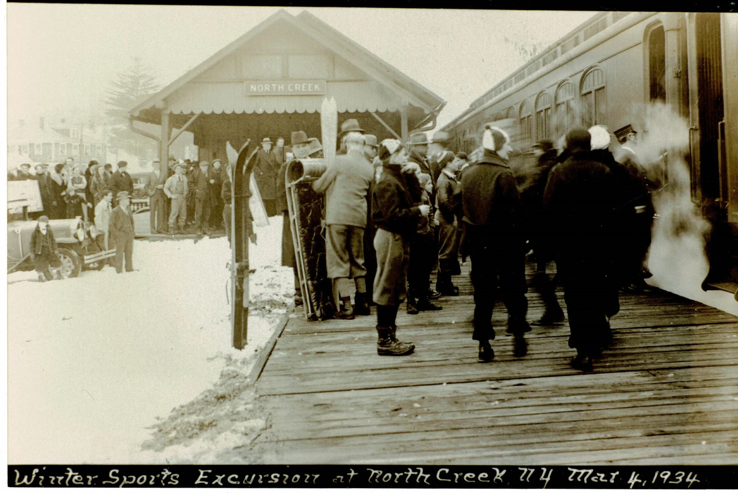 Image of people lining at up at North Creek Station for the ski bowl in the 1930s