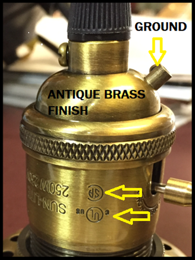 Close-up of a CAST BRASS SOCKET component with an antique finish, STAMPED, CSA , UL.