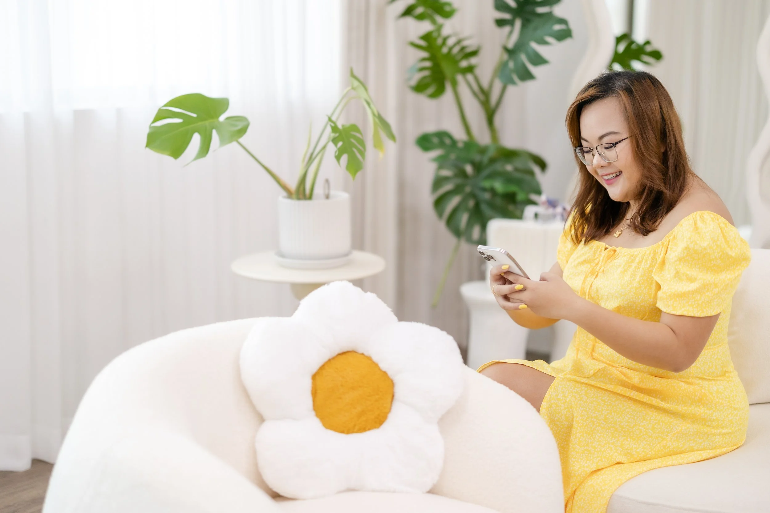 For the love of socials founder, Adel browsing social media on her phone.