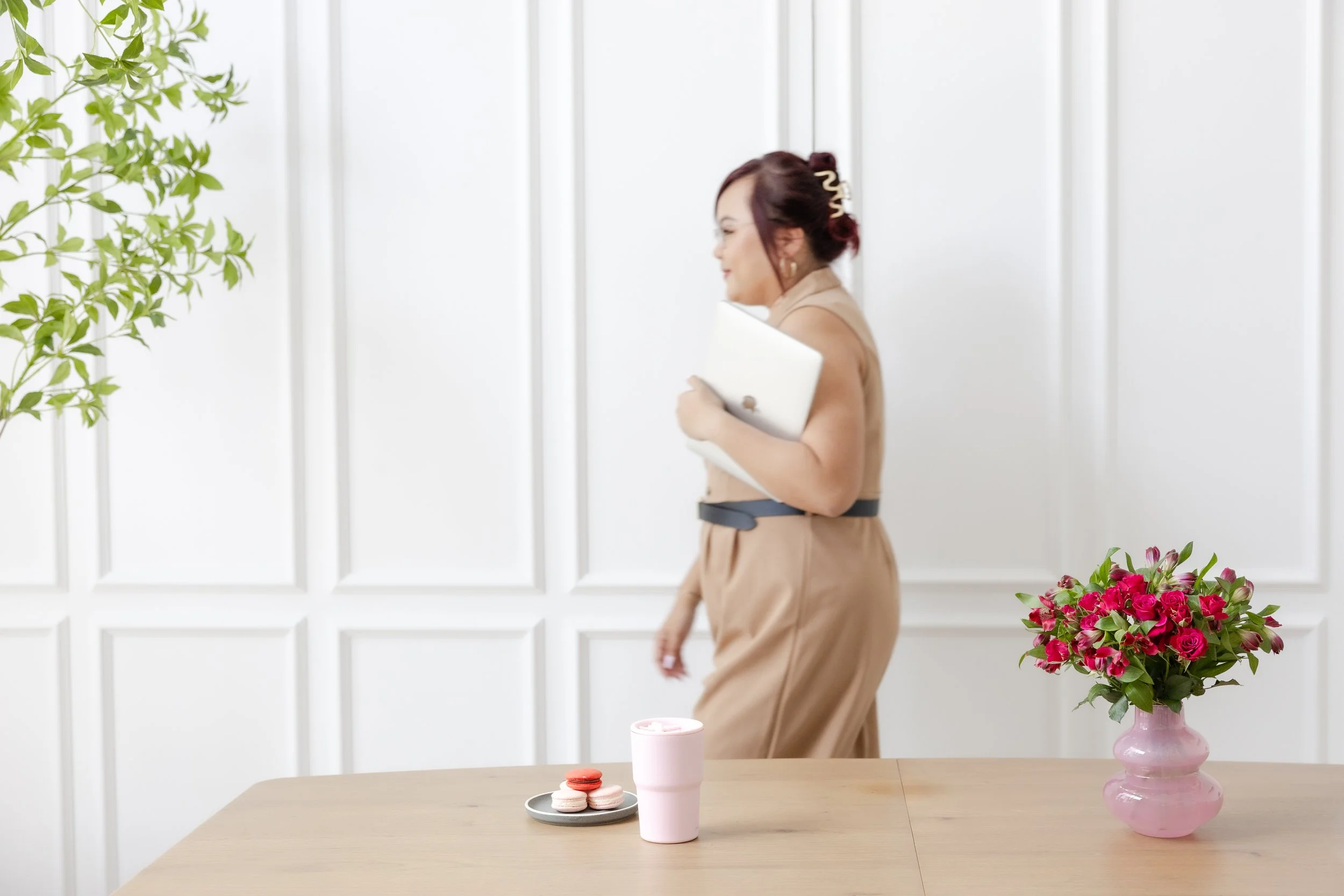 Owner of For The Love Of Socials, Singapore social media agency, smiling confidently in modern office