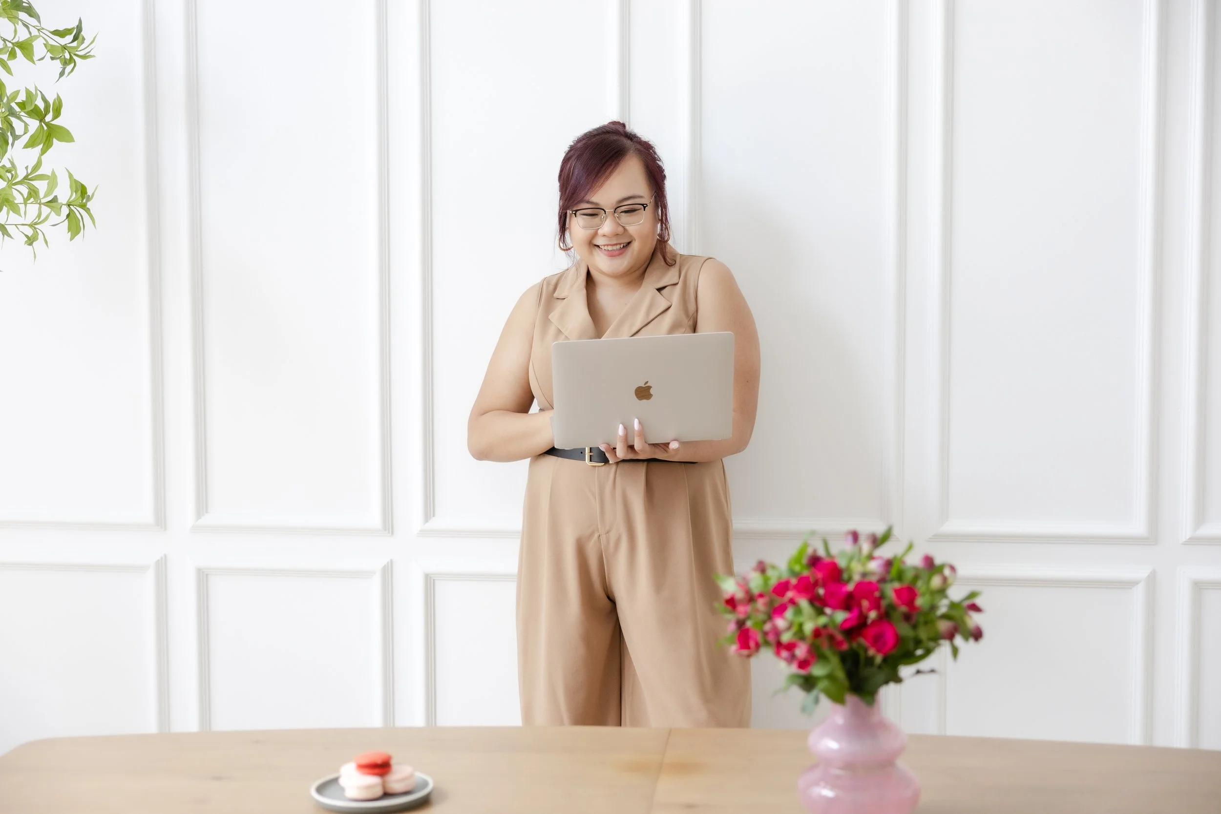Female founder creating authentic social media content on her laptop, showing how human-led storytelling beats AI-generated posts in 2026.