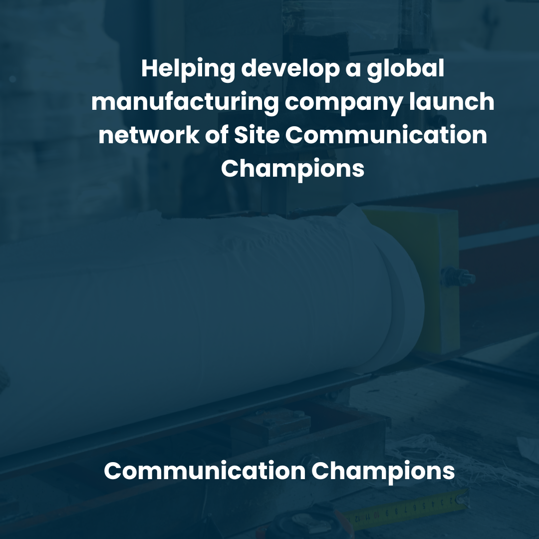 A large roll of material or fabric being processed in an industrial setting with construction tools and equipment around it. Overlaid text states: "Helping develop a global manufacturing company launch network of Site Communication Champions."