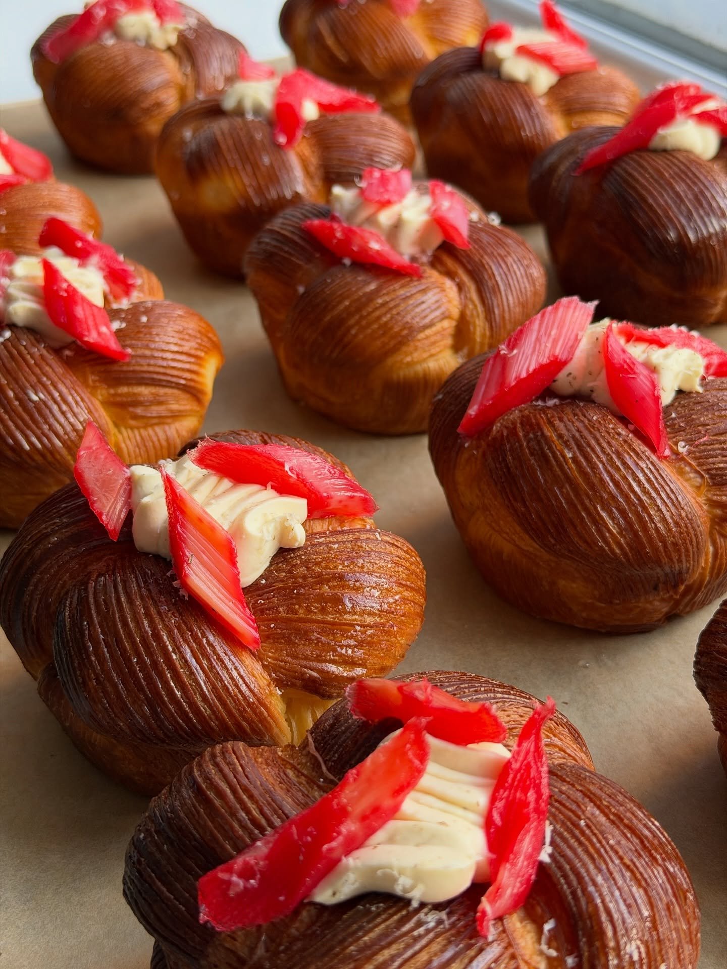 Rhubarb and Tonka.

Buttery, laminated brioche filled with tart, early rhubarb jam and a rich, heady tonka bean cr&egrave;me diplomat. Topped with poached early rhubarb.

On the counter daily in both shops 💕