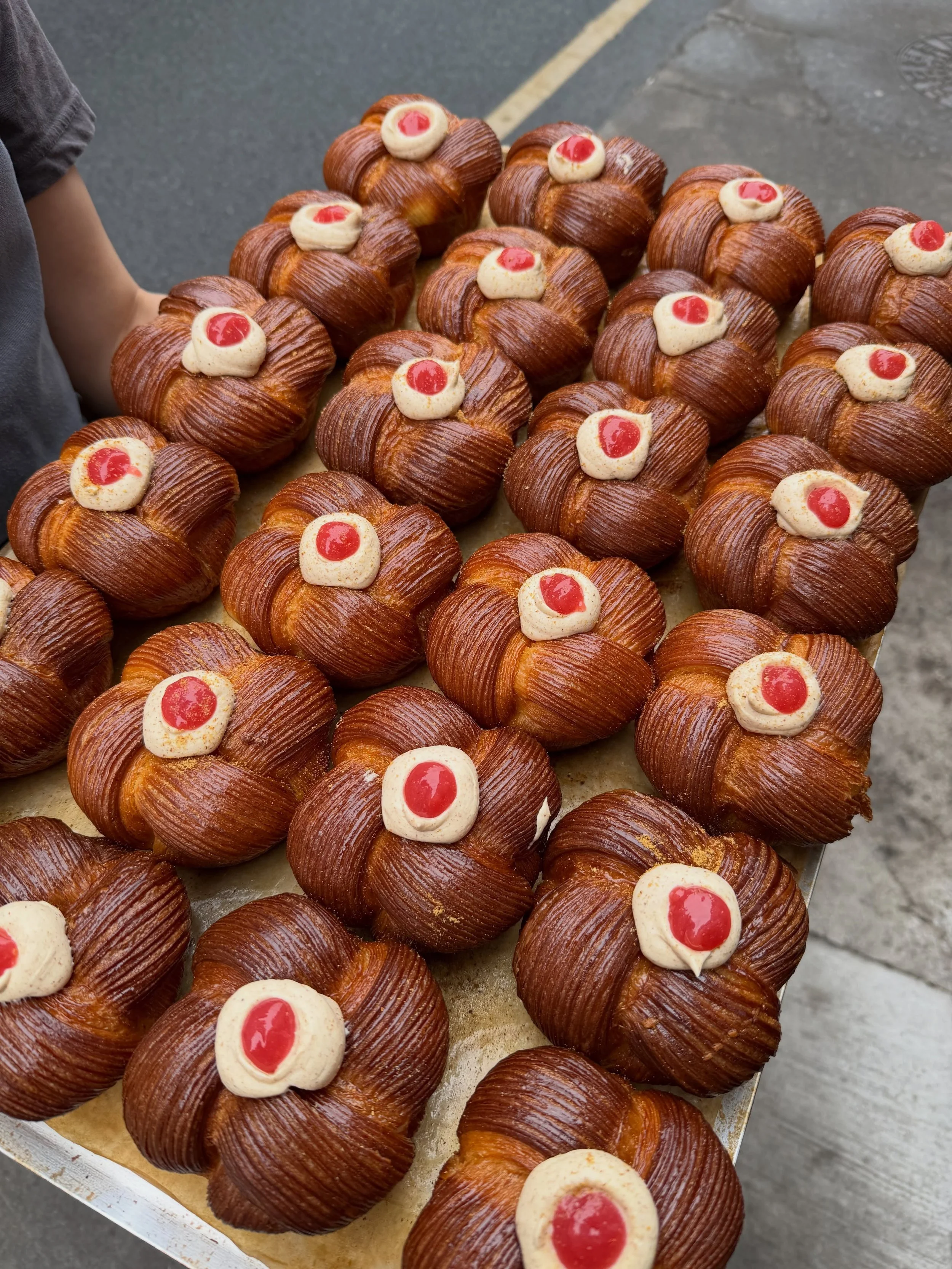 Gooseberry and Toasted Milk.

Laminated brioche (meaning our buttery brioche dough layered with even more butter!) filled with nutty, caramelised toasted milk whipped ganache and tart gooseberry jam. 

A match made in heaven.

On the counter everyday
