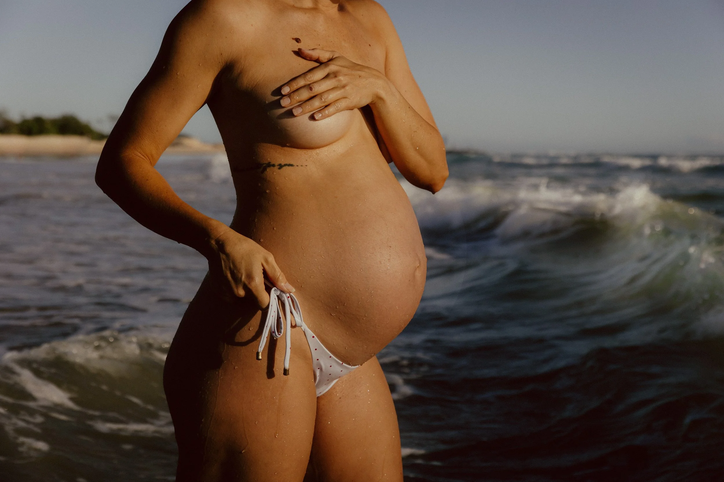 Family at beach by gold coast family photographer