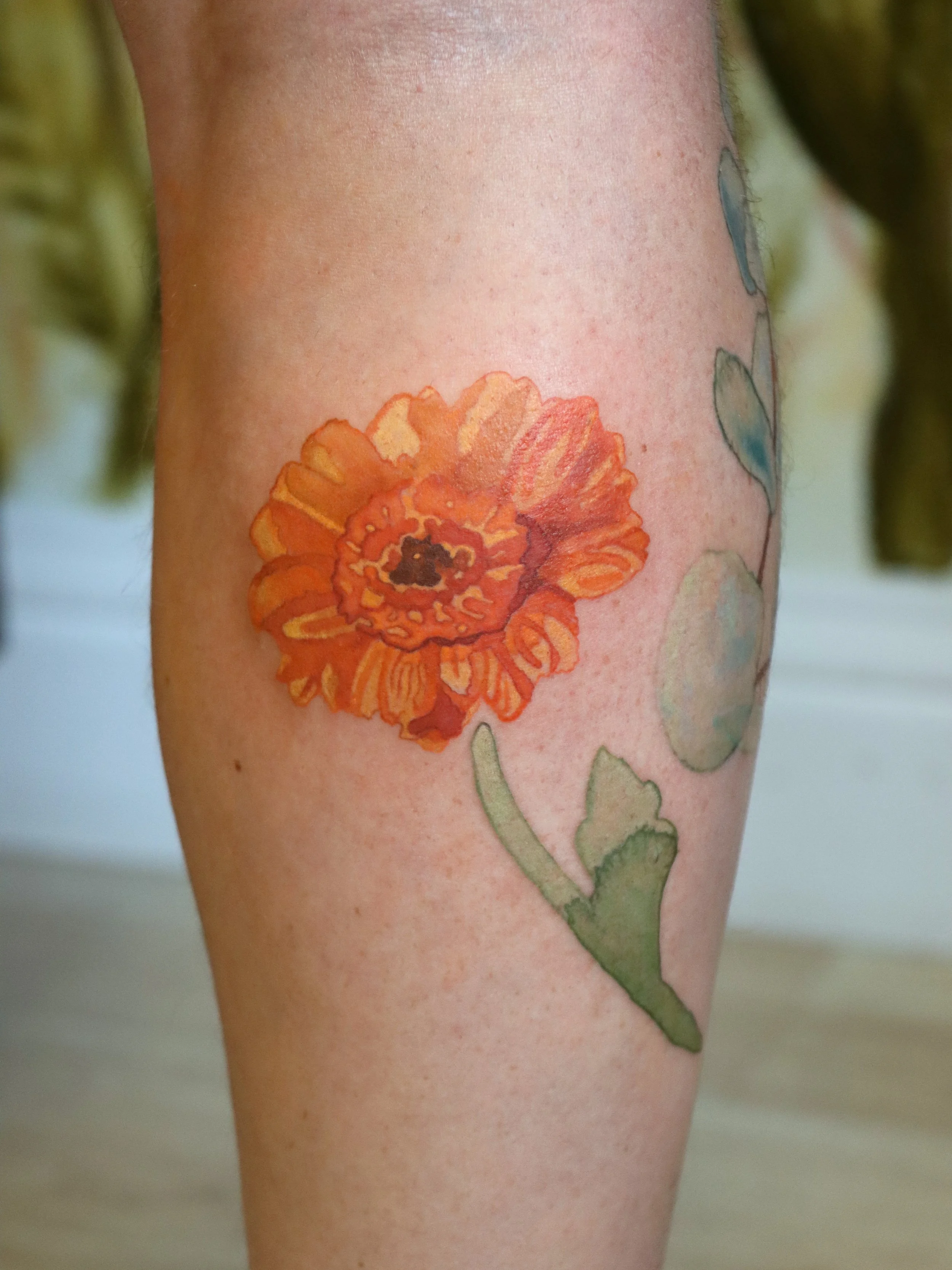 daisy tattoo centered.jpg