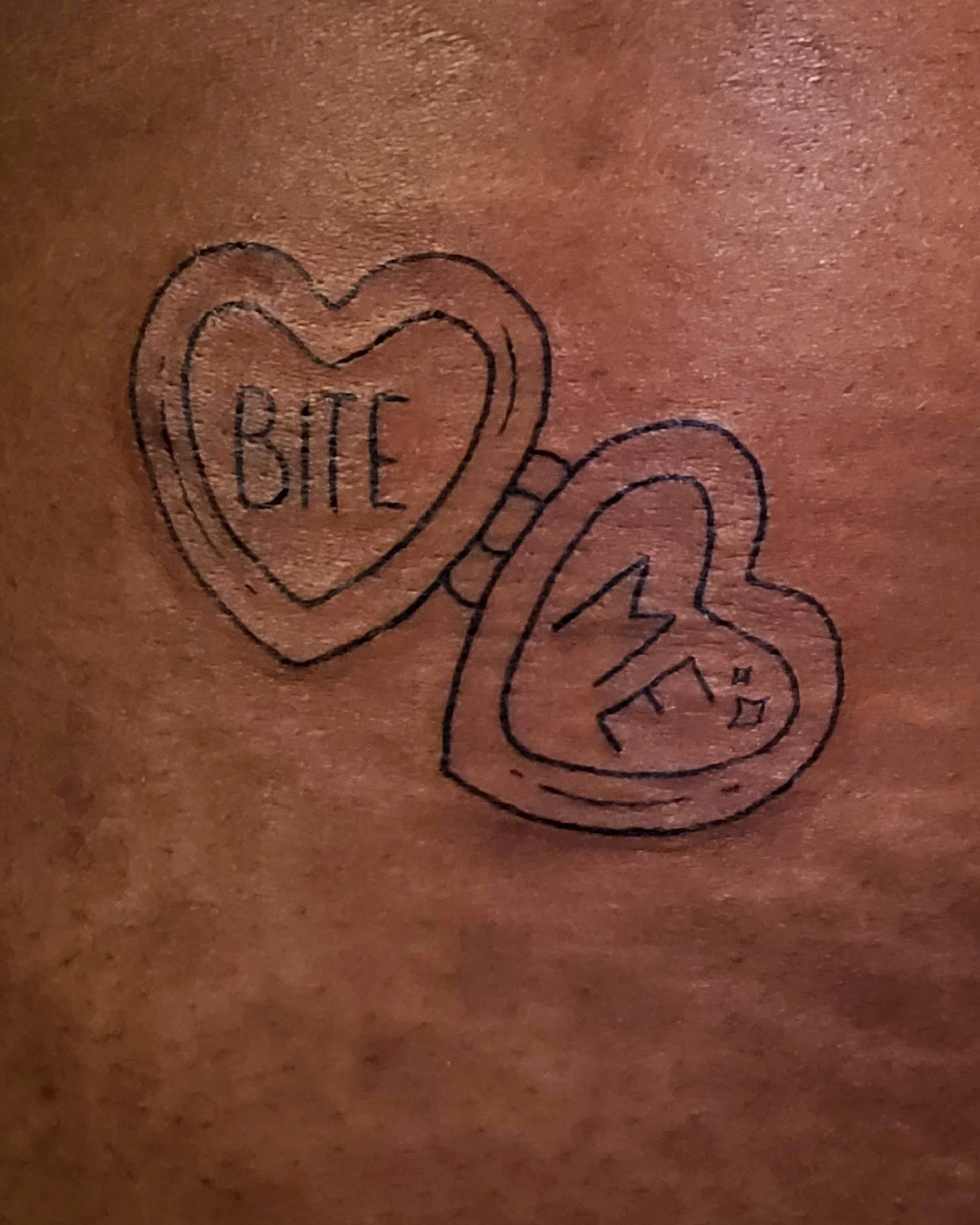 bite me locket on nev.jpg