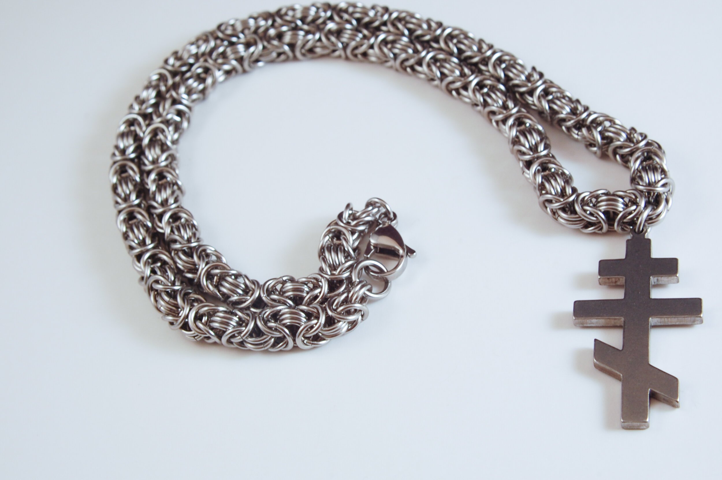 Stainless steel byzantine necklace with steel pendant.