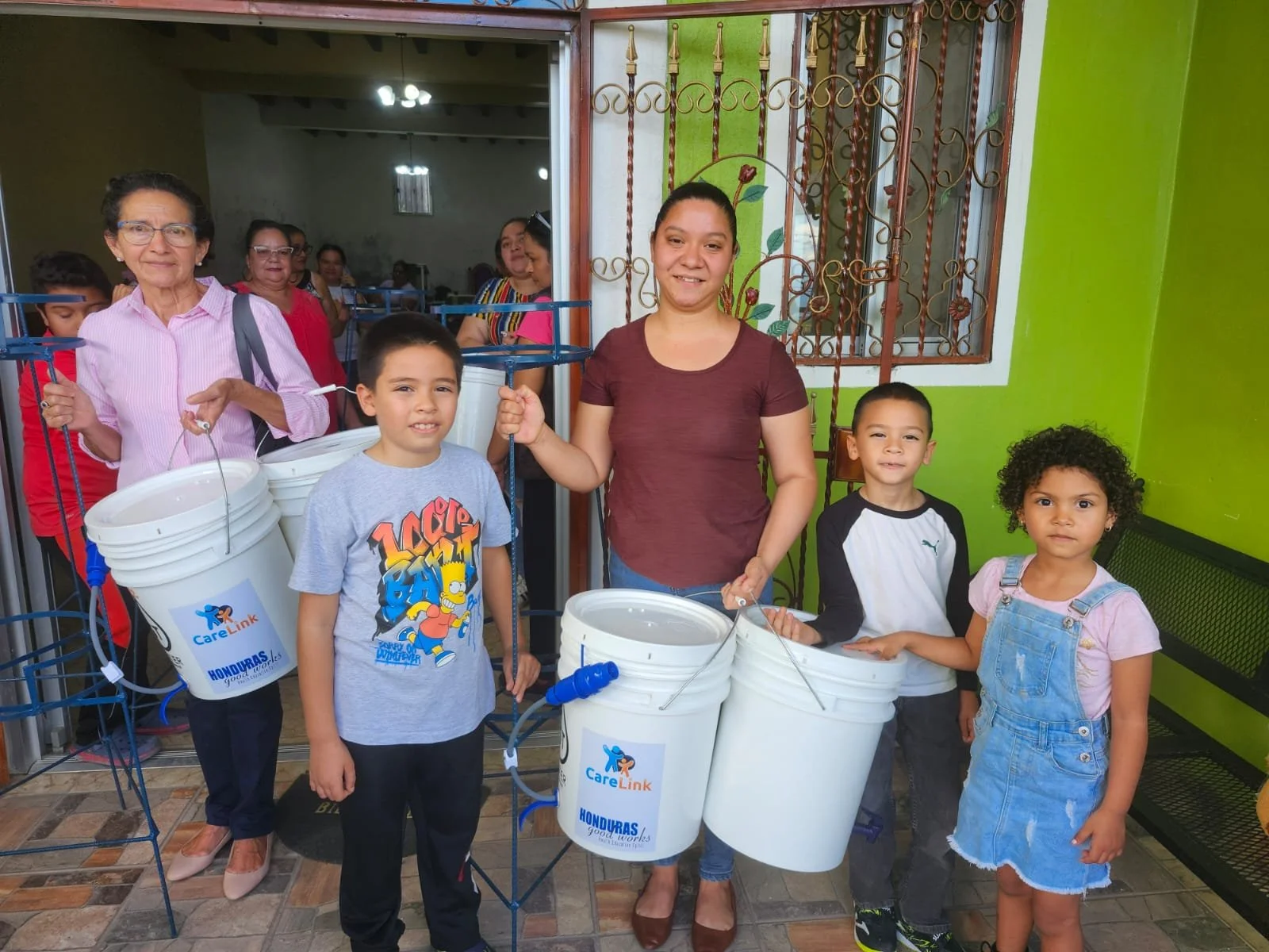 women and kids with buckets.jpg