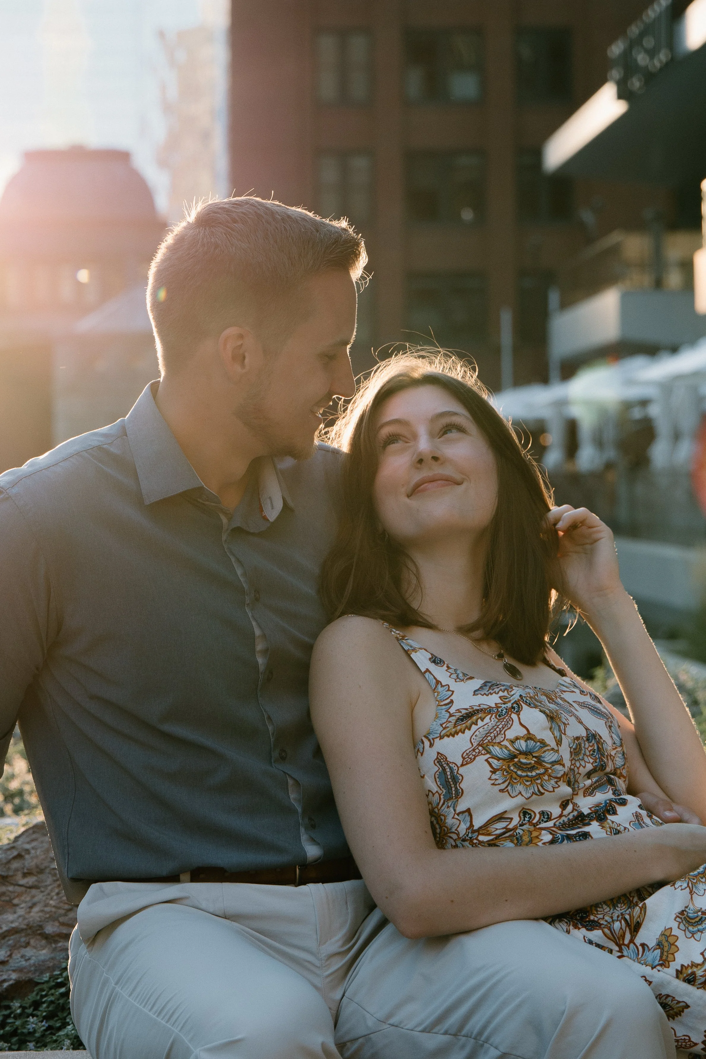 A cute Chicago couple taking photos in the city by the river. CBCZ engagement and proposal photos. Houston & Chicago portrait photographer. 