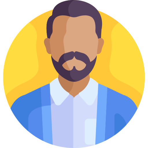 En tecknad bild av en man med mörkt hår, skägg och mustasch, iklädd en blå kavaj och vit skjorta, mot en gul bakgrund.