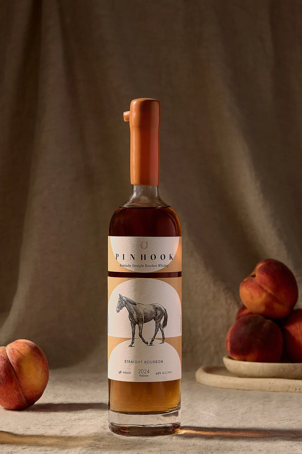 bourbon-bottle-whole-peaches-bowl-summer-cocktail-styling.jpg