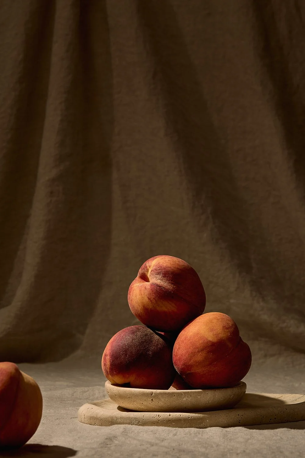 fresh-peaches-travertine-dish-summer-fruit-still-life.jpg
