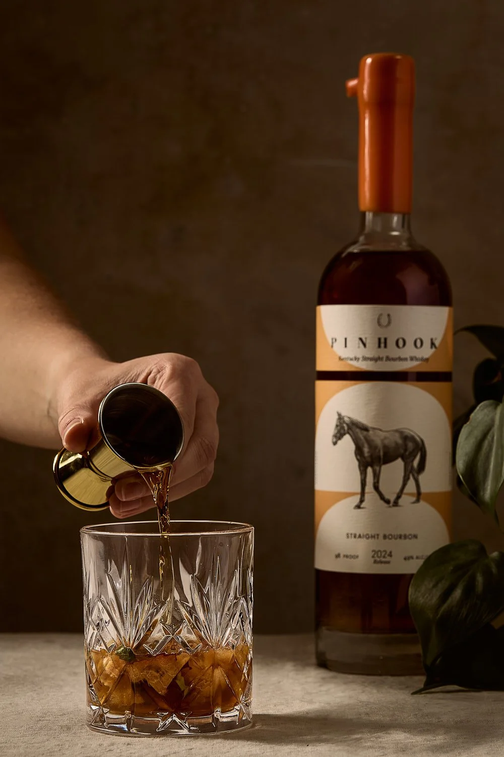 pouring-bourbon-jigger-rocks-glass-cocktail-photography.jpg