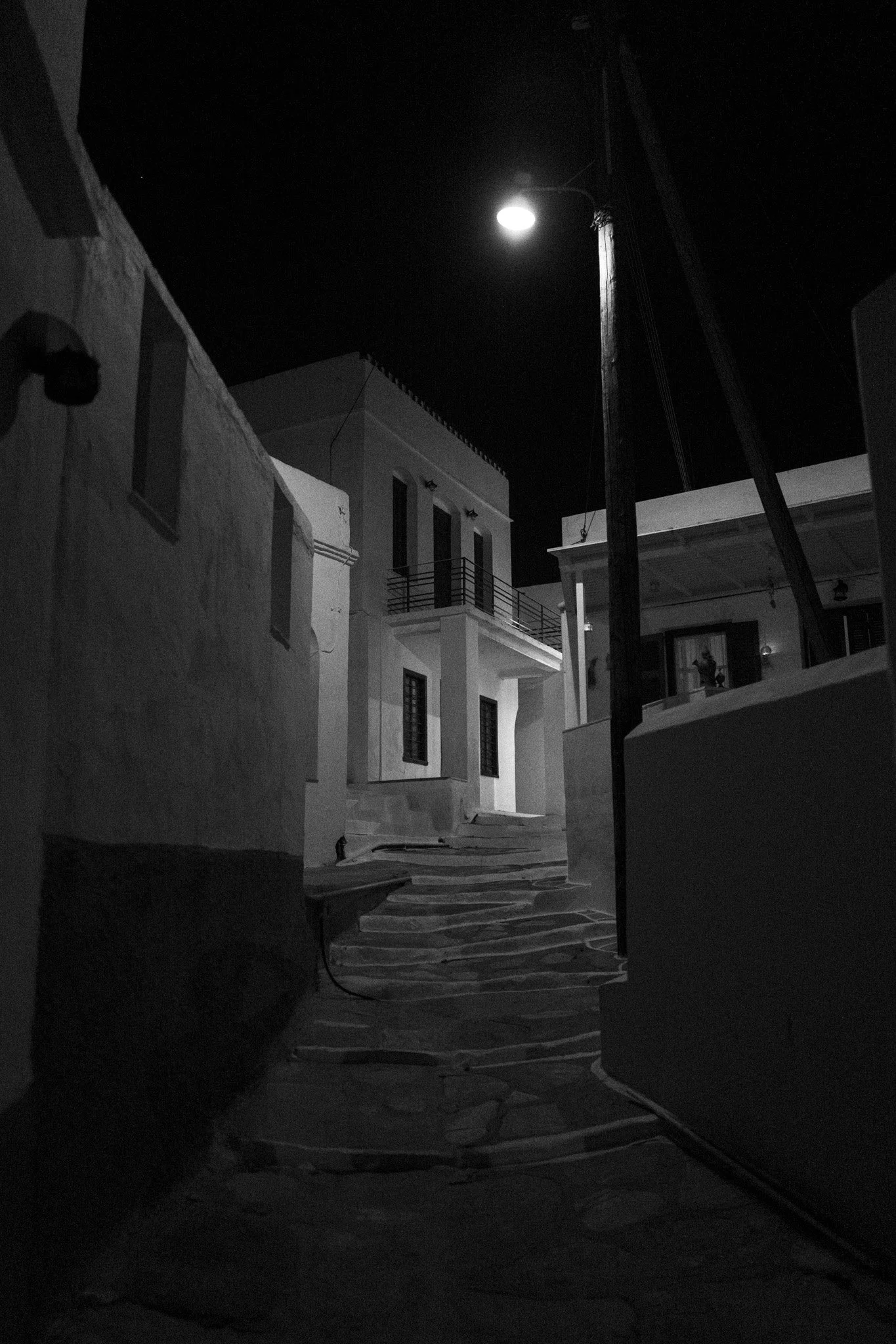 Travel brand photography by New York commercial photographer Adam Lerner - A cobbled stone street at night on a greek island in greece