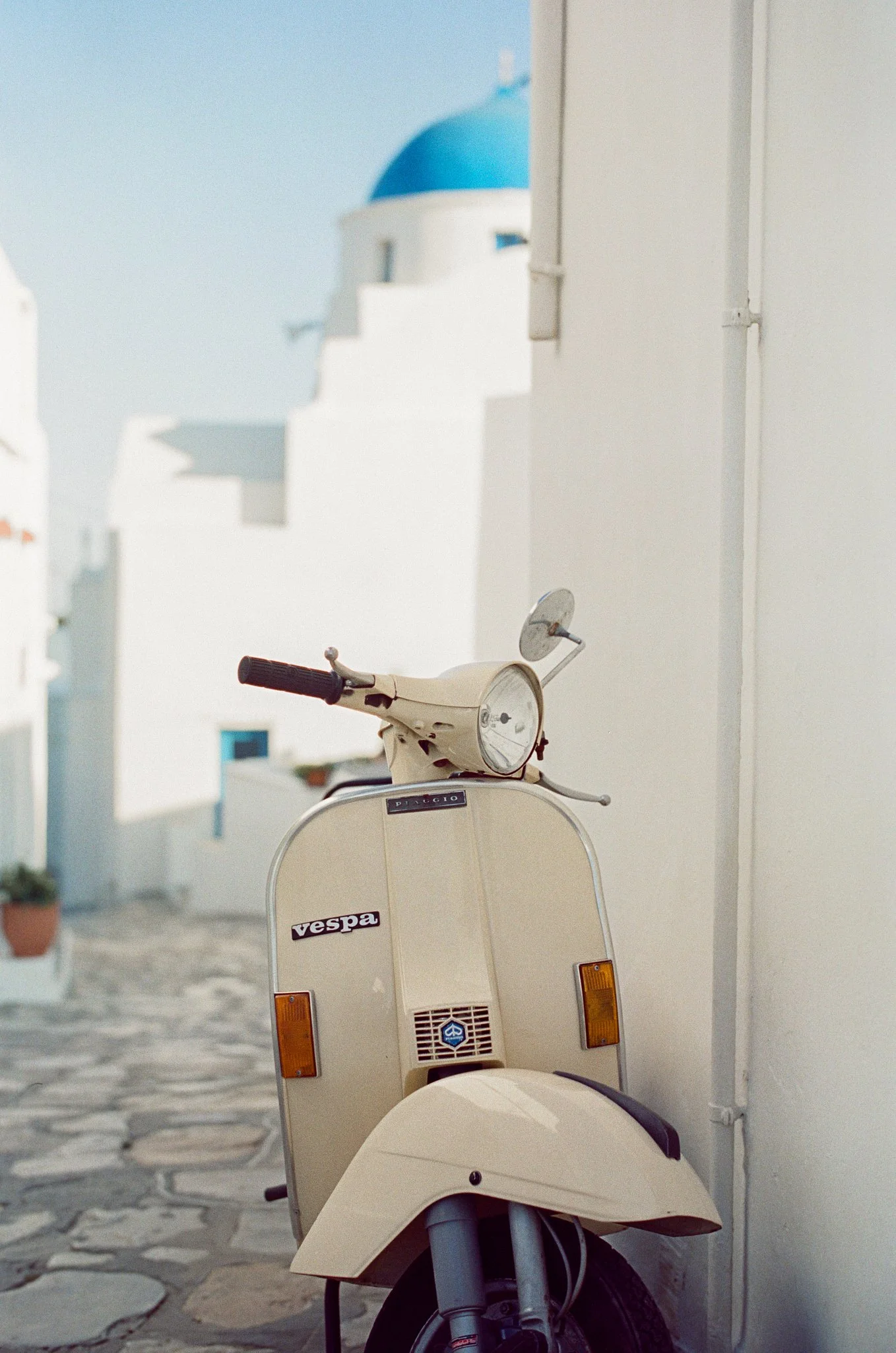 Travel brand photography by New York commercial photographer Adam Lerner - a vespa in a Mediterranean street in Greece.