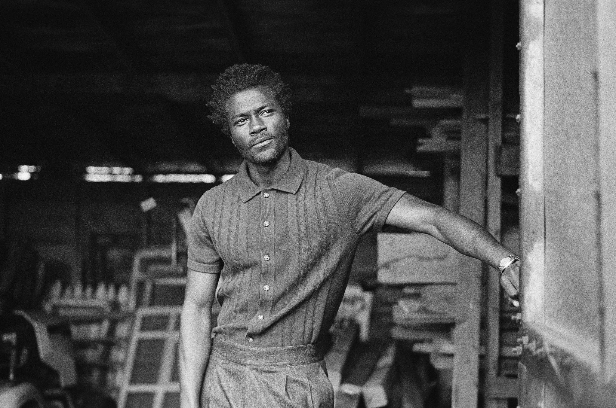 Portrait brand photography by New York commercial photographer Adam Lerner - a black and white portrait of a man in fashionable clothes at a barn in the Hudson Valley New York