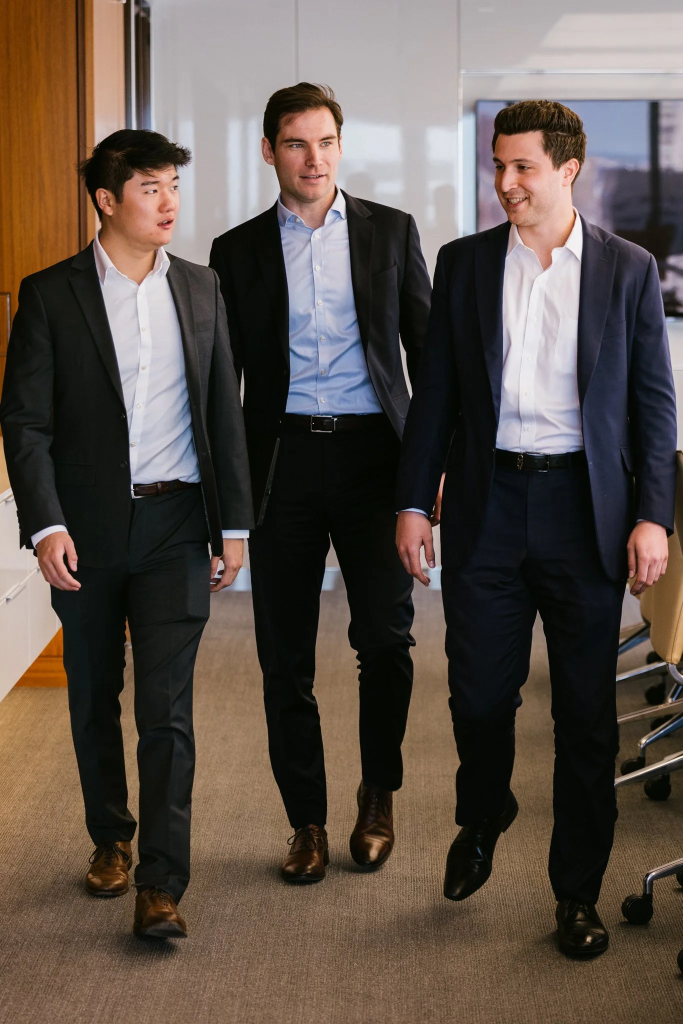 Work life brand photography by New York commercial photographer Adam Lerner - Young businessmen in an office in New York City.
