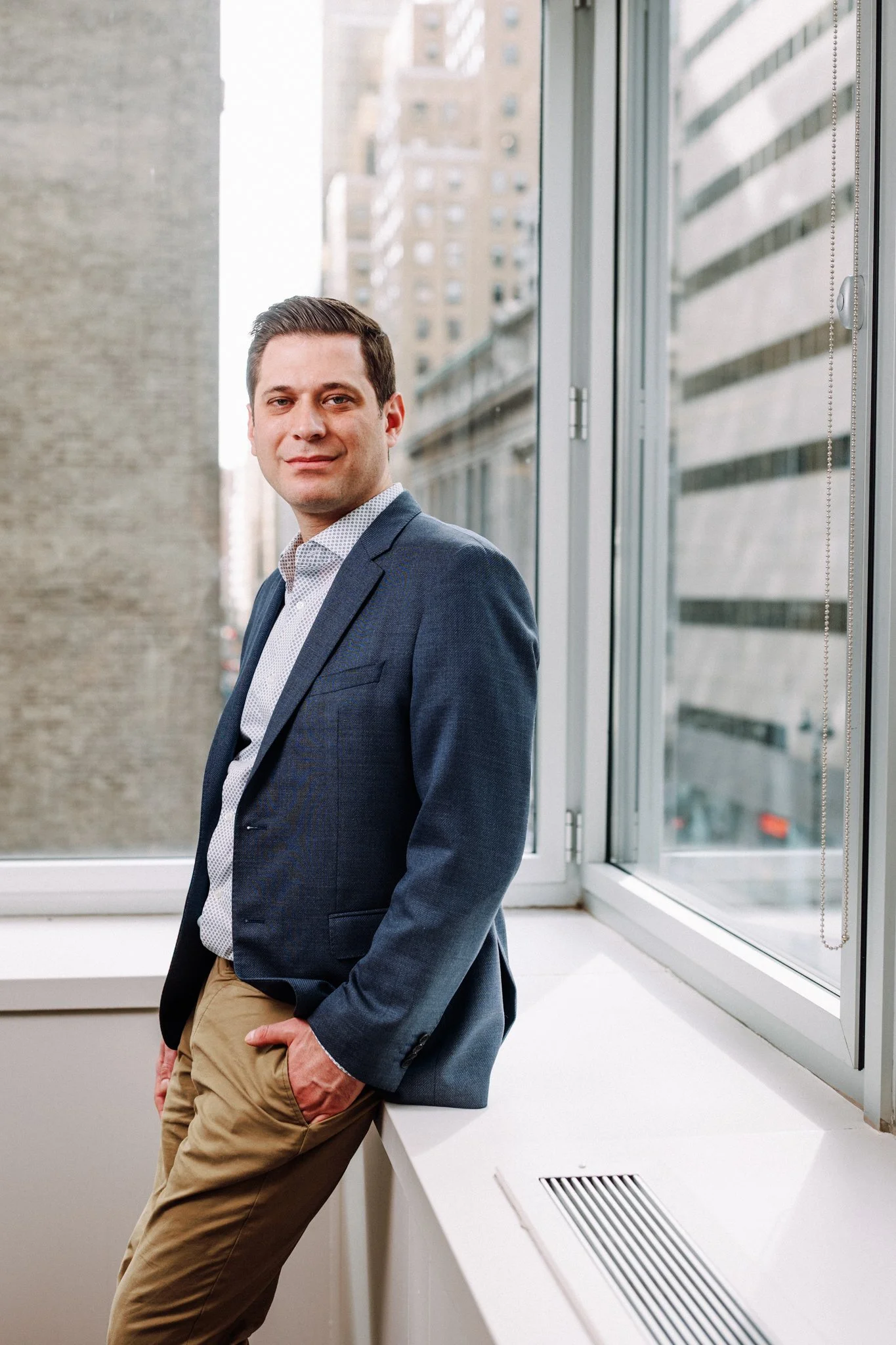 Work life brand photography by New York commercial photographer Adam Lerner - A professional portrait of a  business man in an office in New York City.
