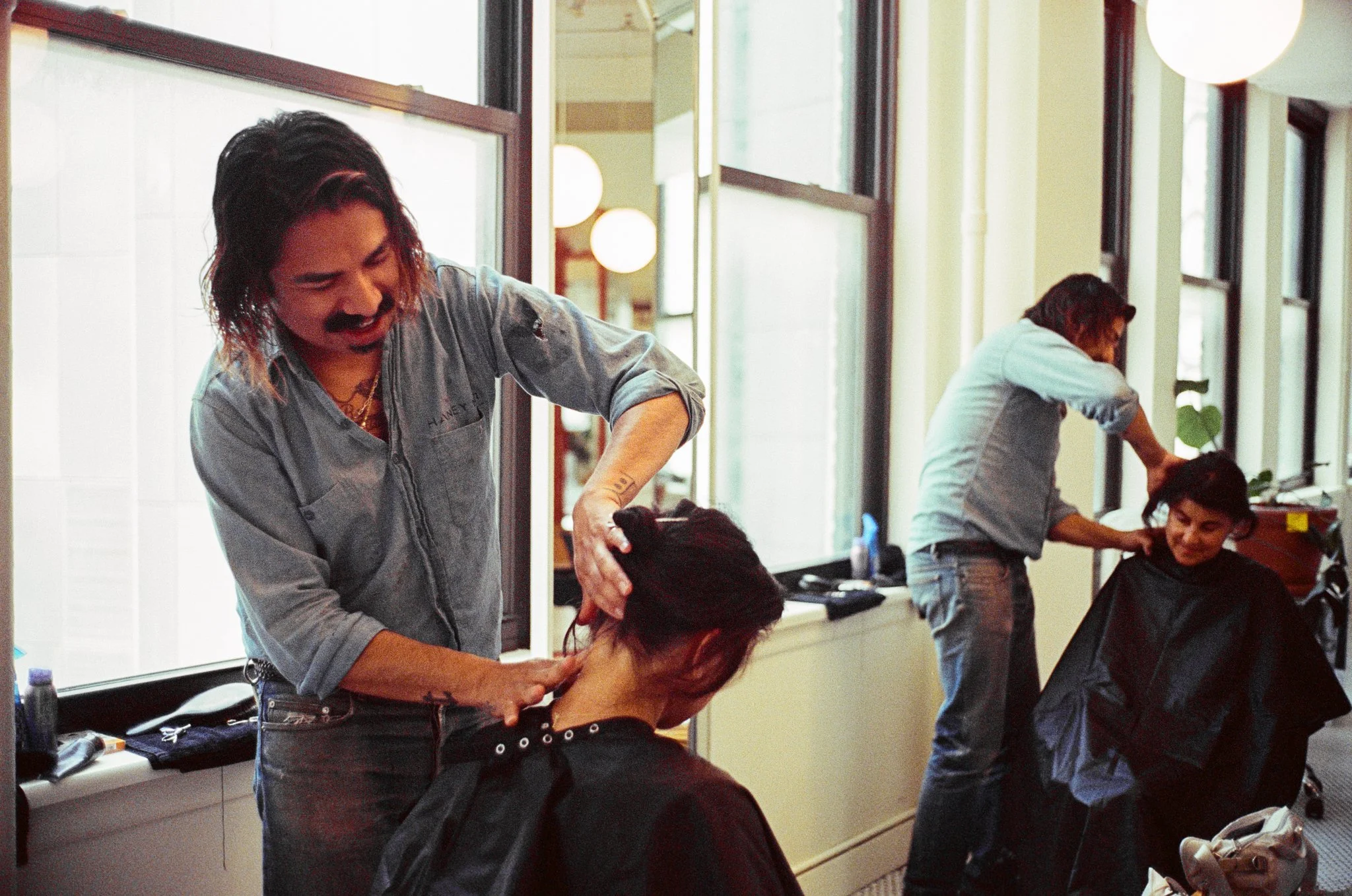 Work life brand photography by New York commercial photographer Adam Lerner - A hairdresser at work in New York City.