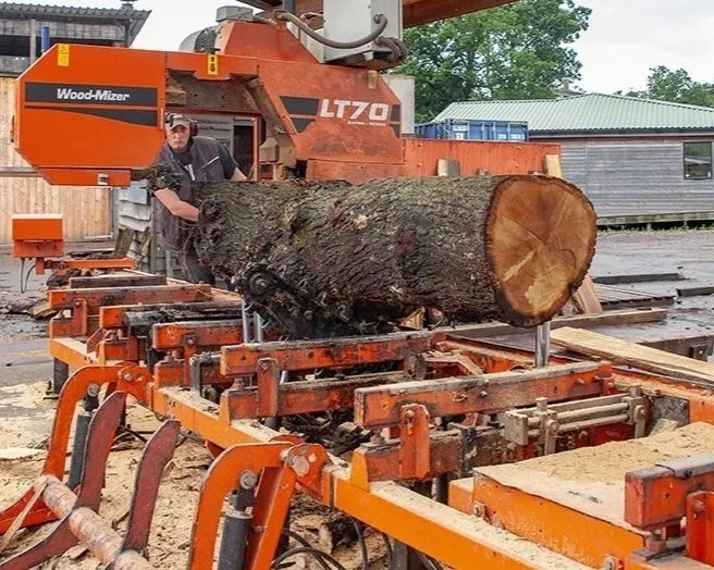 Sawing oak logs on a Wood Mizer sawmill by ASHS member Scottish Wood